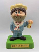 Front view showing figure details, base text