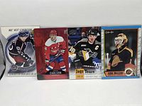 Front view of all four hockey trading cards in lot