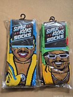 Front view of both sealed pairs showing packaging and designs