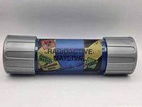 Closed blue radioactive canister showing hazard labels