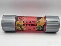 side view of red translucent canister with warning decals