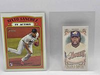 Front view of both cards in toploaders