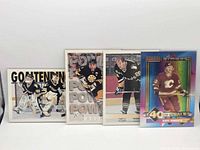 Fronts of all four hockey cards aligned