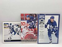 Front view of all three cards displaying players and designs