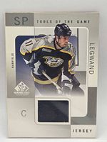 Front of card showing player image, SP Game-Used branding and navy swatch