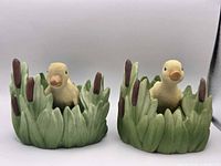 Front view of both duck figurines showing overall design and color