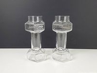 Front view of both clear glass dumbbell beer glasses