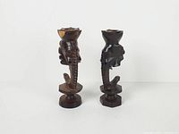 Front view of both elephant candle holders showing overall design