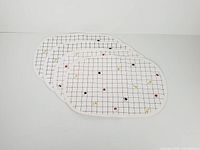 Stack of four oval placemats showing overall design