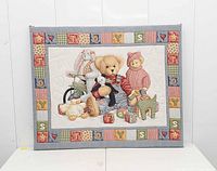 Front view of quilted nursery wall art panel