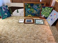 All eight artworks grouped for scale and variety