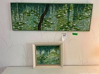 Both framed paintings displayed together for scale reference