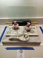Full lot showing marble board, rolling pin, glass panel, chef shakers, tile trivets, spoon rest