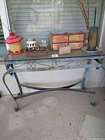 Full view of metal console table and all accessories on top