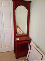 Full front view showing mirror, drawer, shelf, hooks