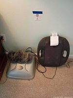 Vibration plate, faux fur pad, and Trucore massager side by side