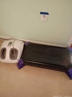 Both items: foot massager and aerobic step platform