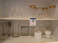 Overview of all glass and ceramic items on two shelves