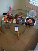 top view showing round glass surface and items for scale