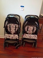 Two folded Cloud Sport strollers front view