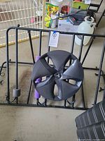 Overall view of roof cargo rack with Tesla hubcap placed on top