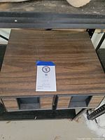 Woodgrain VHS storage box closed on shelf