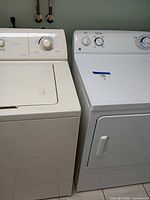 Washer and dryer side by side, front view