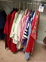 Rack of assorted tops showing variety of colors and styles