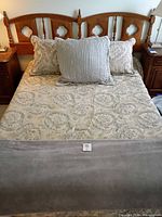 Headboard, bedding set on bed
