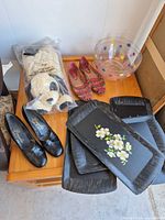 Overall lot showing trays, plush dog, two pairs shoes, polka-dot bowl