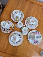 Bottom stamps showing brands on all teacups and saucers