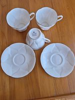 All three teacups and two saucers displayed top view