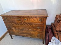 Full front view of dresser showing five drawers and hardware