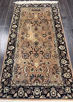 Full view of rug showing pattern, border and fringe