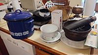 Overall lot showing enamel pot, insulated bottle, wooden bowl, box, ceramics, tray