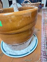 planter base on saucer showing glaze and deposits