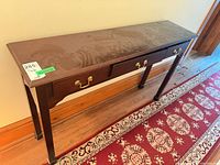 Top angled view of full console table showing veneer surface and two drawers