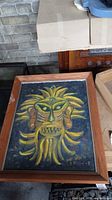 Framed oil painting showing entire artwork in wood frame