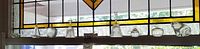 Overall view of eight glass and crystal pieces on window ledge