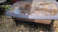 Full view of wicker table with glass top on deck