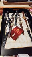 Overview of tray containing all wristwatches