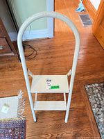 Front view showing full stool structure and handle