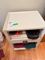 Front view of nightstand showing drawer and shelves