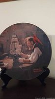 Plate with ship modeller scene on stand