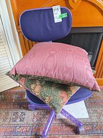 Chair with two pillows stacked on seat