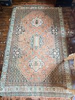 Full view of entire rug showing pattern, size and wear