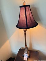 Full view of first lamp showing base, column, and shade