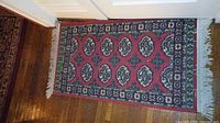 Full view of rug showing pattern, field color and fringe