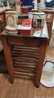 Full view of kitchen cart with slatted shelves and glass top