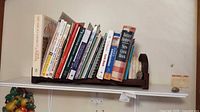 overall lot: bookends, figurine, 24 cookbooks